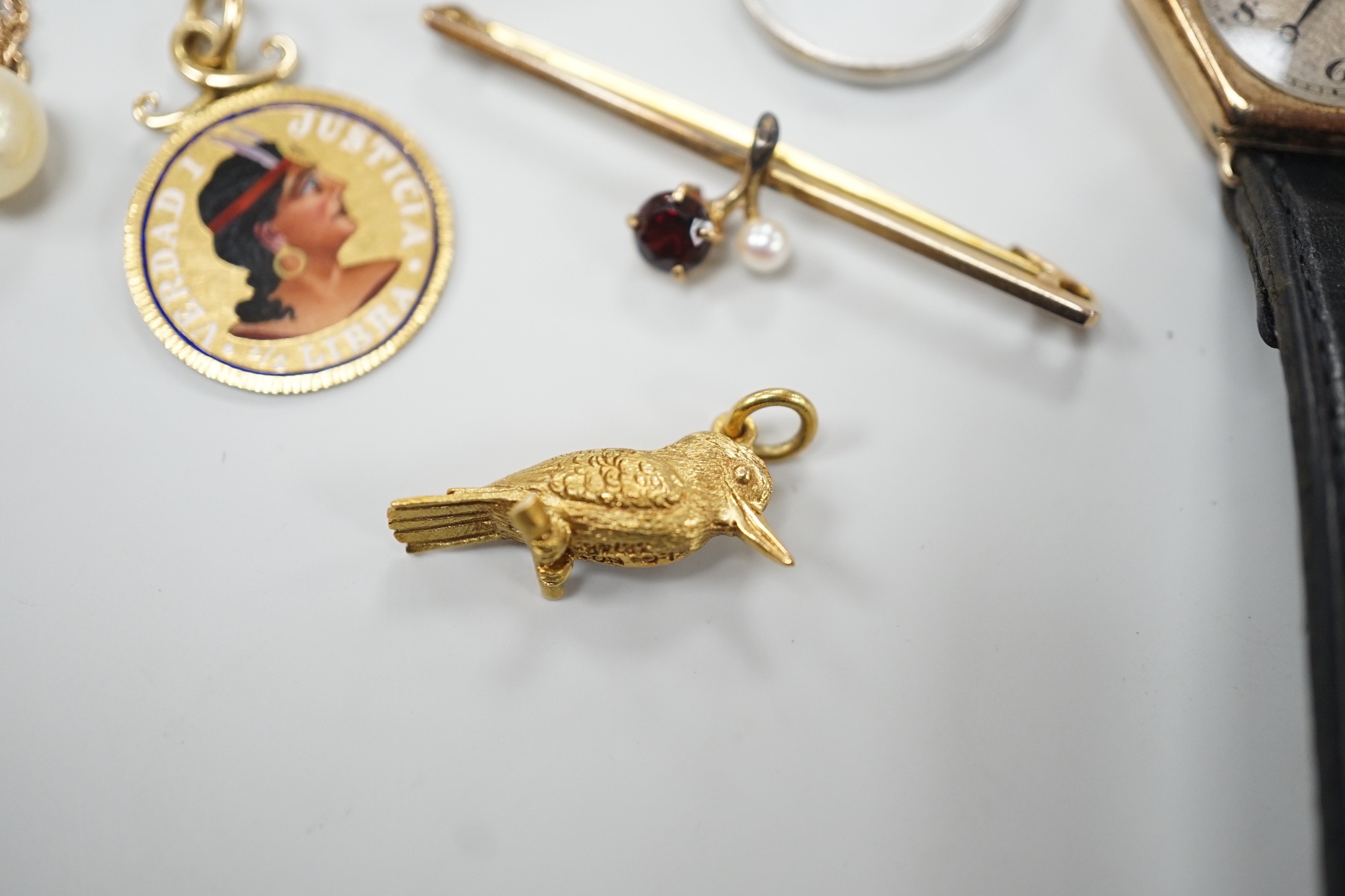 A platinum wedding band, 2.3 grams, a 9ct gold, garnet and seed pearl set bar brooch, a bird charm, a yellow metal and enamelled pendant on a 9ct chain, a 9ct and cultured pearl pendant necklace, a lady's 9ct gold hexago
